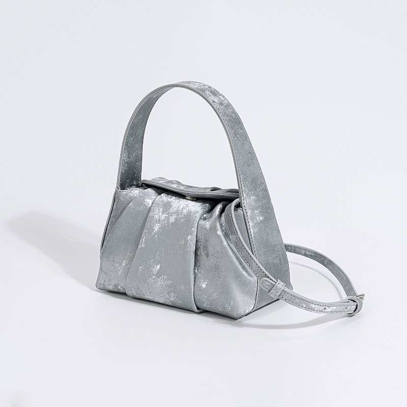 Leather crossbody bag with a sculpted handle